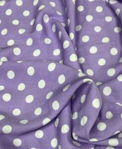 Crêpe polyester fond lilas pois blancs