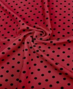 Crêpe polyester fond rouge pois noirs