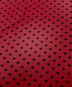 Crêpe polyester fond rouge pois noirs