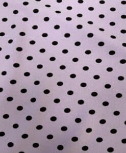 Crêpe polyester fond fuchsia pois noirs