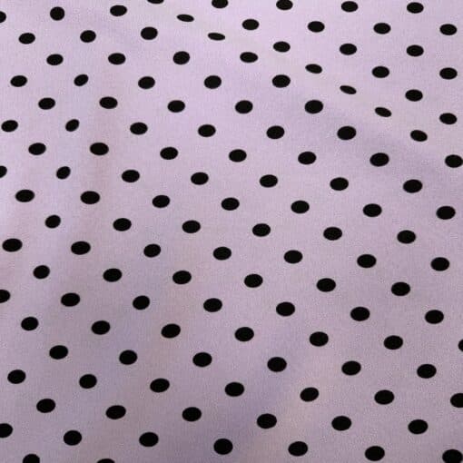Crêpe polyester fond fuchsia pois noirs
