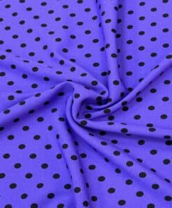 Crêpe polyester fond violet pois noirs