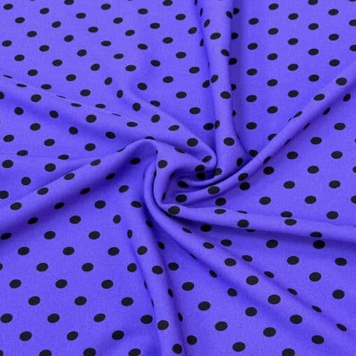 Crêpe polyester fond violet pois noirs