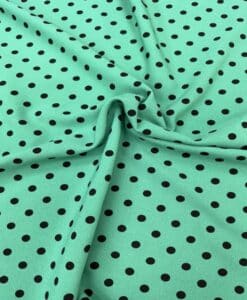 Crêpe polyester fond vert canard pois noirs