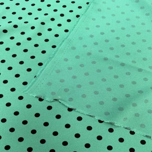 Crêpe polyester fond vert canard pois noirs