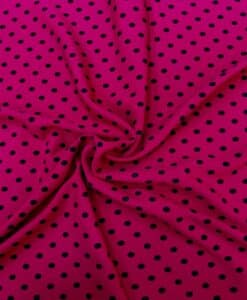 Crêpe polyester fond fuchsia pois noirs