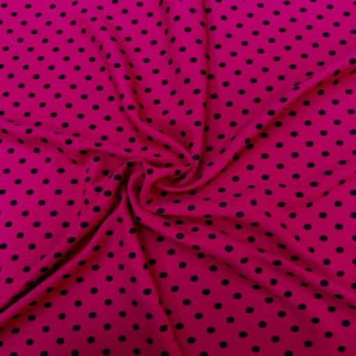 Crêpe polyester fond fuchsia pois noirs