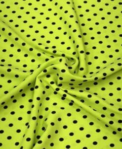 Crêpe polyester fond vert anis pois noirs