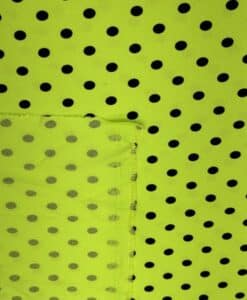 Crêpe polyester fond vert anis pois noirs