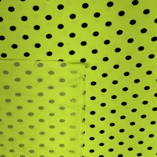 Crêpe polyester fond vert anis pois noirs