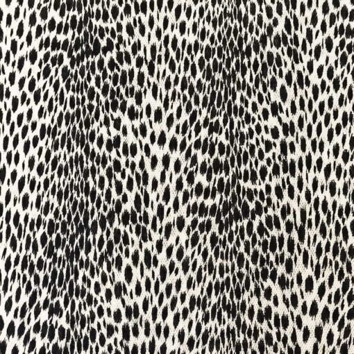 Tissu polyester léopard noir sur fond blanc
