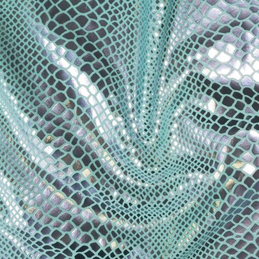 Lycra pailleté serpent fond bleu ciel pailleté lilas