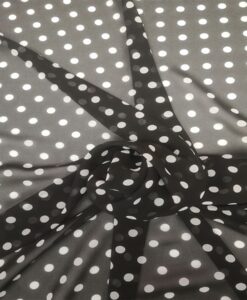 Tissu mousseline fond noir pois blanc