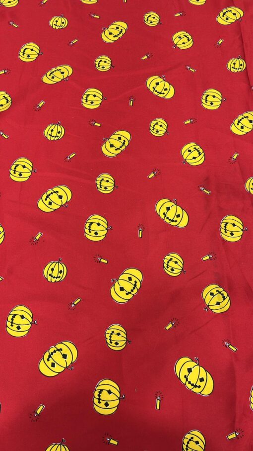 Tissu carnaval imprimé fond rouge citrouille
