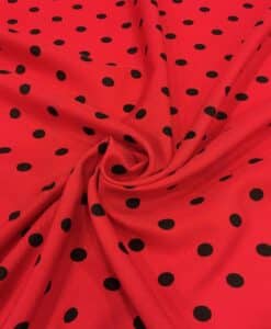 Tissu Burlington fond rouge petit pois noir