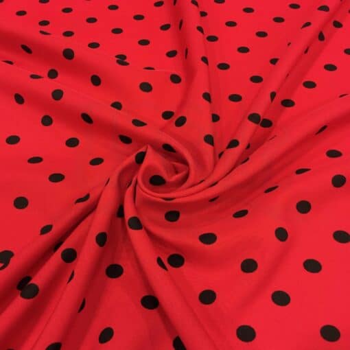 Tissu Burlington fond rouge petit pois noir