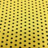 Tissu burlington petit pois noir sur fond jaune